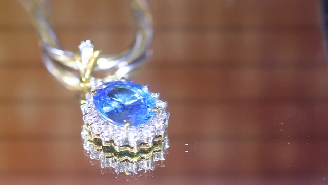 Blue sapphire diamond necklace close-up shot in the studio.