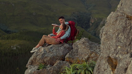 Hiking, mountain and drinking water, couple relax on outdoor adventure and peace in nature with...