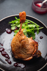 duck leg confit berry sauce poultry meat eating cooking appetizer meal food snack on the table copy space food background rustic top view