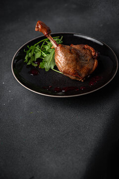 duck leg confit berry sauce poultry meat eating cooking appetizer meal food snack on the table copy space food background rustic top view