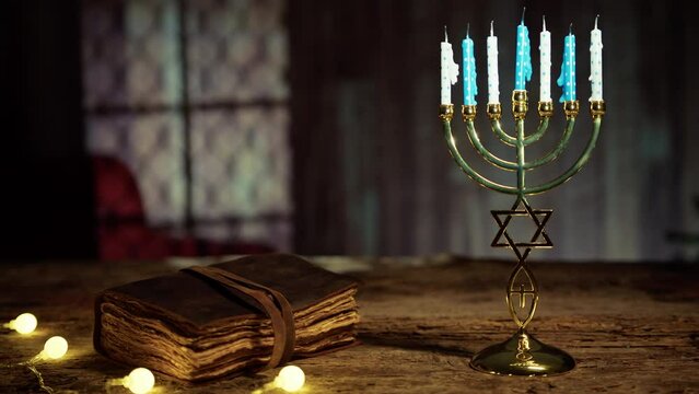 Closed old book with Hanukkah Candlestick and lights 
