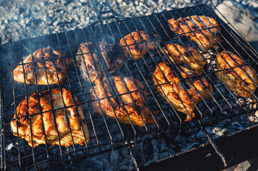 Close-Up of Juicy Chicken Fillets Sizzling on Hot Grill, Perfectly Cooked to Charred Perfection