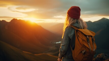 Young woman traveler taking photo with smartphone at sea of mist and sunrise over the mountain.