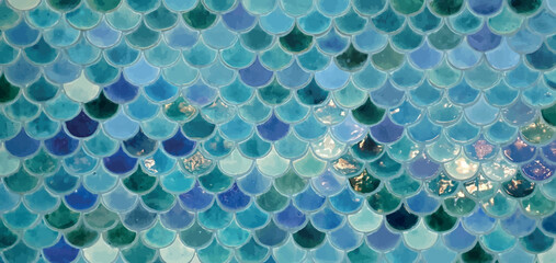 Tile with sea pattern vector. Beautiful mosaic tiles in a marine style. Tiles with a marine pattern. Blue tile with a geometric fish scale pattern. Tile sea waves abstract vector. © Nataly G
