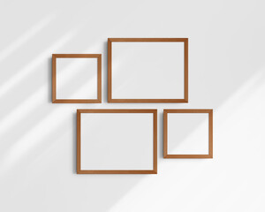Gallery wall mockup set, 4 cherry wood frames. Clean, modern, and minimalist frame mockup. Two horizontal frames and two square frames, 14x11 (14:11), 8x8 (1:1) inches. White wall with shadows.