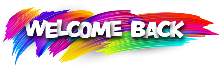 Welcome back paper word sign with colorful spectrum paint brush strokes over white.