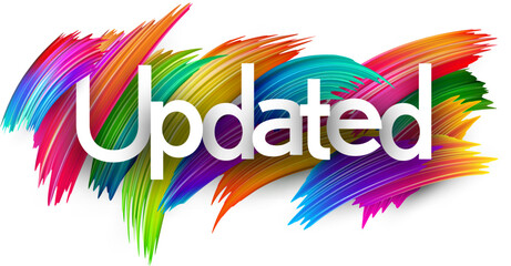 Obraz premium Updated paper word sign with colorful spectrum paint brush strokes over white.