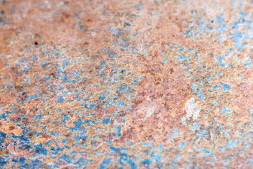 Selective focus on an area of a rusty metal texture.