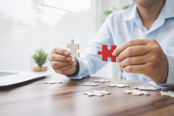 person hand connecting jigsaw puzzle pieces, business solutions, goals, success, goals and strategy...