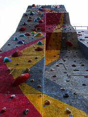 Bottom view of climbing wall outdoors.