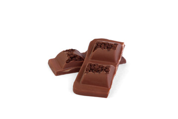 Pieces of milk chocolate with filling and decorated with crumbs isolated on white background.