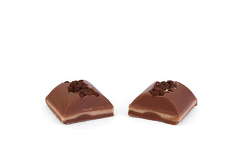Two pieces of milk chocolate with filling isolated on white background.