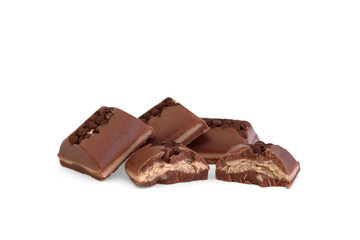 Broken piece of milk chocolate with filling and decorated with crumbs isolated on white background.