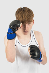 Teenage boxer boy with guard raised