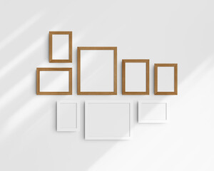Gallery wall mockup, 8 white and cherry wood frames. Frame mockup. Horizontal, vertical frames, 4x6 (2:3), 6x4 (3:2), 5x7 (5:7), 7x5 (7:5), 8x10 (4:5), 10x8 (5:4) inches. White wall with shadows.