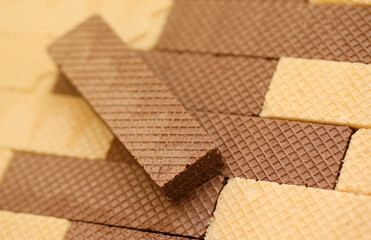 Stacked delicious chocolate wafers in large amount. Two different flavours of classic small waffles