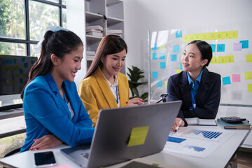 Creative business professionals planning a project in an office. Teamwork and collaboration in a modern workplace, Group of business people having a meeting in a tech company.