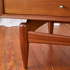 Mid-Century Modern coffee table. Vintage walnut furniture. Close-up detail photograph.