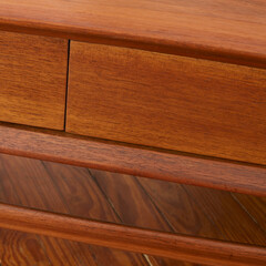 Mid-Century Modern coffee table. Vintage walnut furniture. Close-up detail photograph.