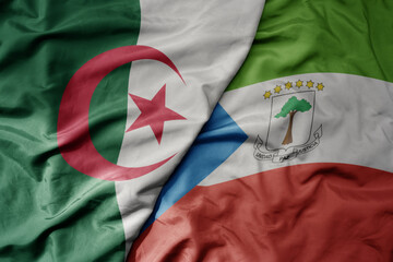 big waving national colorful flag of algeria and national flag of equatorial guinea .