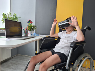 Fototapeta na wymiar Disabled child girl using virtual reality headset with raised hands at home