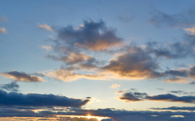 Fototapeta na wymiar Beautiful sky background - Sunset Sunrise sky with light clouds and real sun.