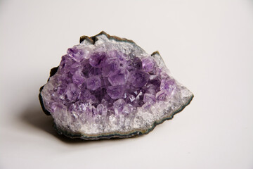 Amethyst stone mineral purple color on a white background
