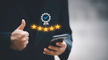 Hand shows the sign of the top service Quality assurance 5 star, Guarantee, Standards, ISO certification and standardization concept.
