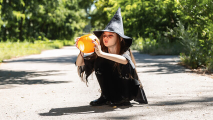 Kid going trick or treating. Low section shot of child in festive Halloween costume with cute...