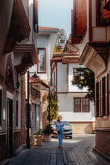 Tourist (woman) walking in the old town of Antalya Turkey.