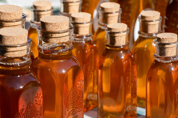 honey bottles with corks at a local farmers market