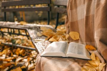 Open Bible on a blanket, autumn