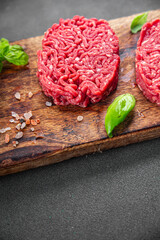cutlet raw meat fresh appetizer beef hamburger cooking eating meal food snack on the table copy...