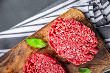cutlet raw meat fresh appetizer beef hamburger cooking eating meal food snack on the table copy...
