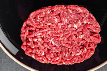 cutlet raw meat fresh appetizer beef hamburger cooking eating meal food snack on the table copy...
