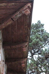 A brick building with a tree in the front