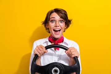 Photo of excited cheerful girl wear trendy outfit hold steering wheel driving own car weekend trip...