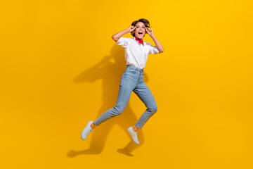 Fototapeta na wymiar Full length photo of cheerful funky girl wear stylish clothes rejoicing having fun isolated on yellow color background