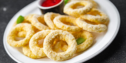 onion rings deep fryer tomato sauce fast food eating cooking meal food snack on the table copy space food background rustic top view