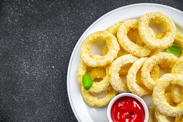 onion rings deep fryer tomato sauce fast food eating cooking meal food snack on the table copy space food background rustic top view