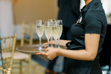 A champagne glass during a wedding reception for guests to enjoy.