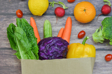 Healthy food background, healthy vegetarian food in paper bags, fruits and vegetables, banner copy space, supermarket shopping, food and clean vegetarian diet concept, organic fruits and vegetables co