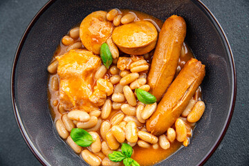 cassoulet thick bean soup with meat, beans, sausages delicious healthy eating cooking appetizer meal food snack on the table copy space