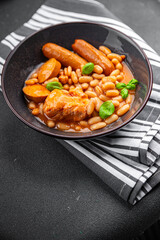 cassoulet thick bean soup with meat, beans, sausages delicious healthy eating cooking appetizer meal food snack on the table copy space