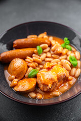 cassoulet thick bean soup with meat, beans, sausages delicious healthy eating cooking appetizer meal food snack on the table copy space