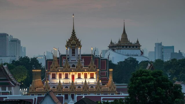 4K Time lapse of Aerial view Wat Ratchanatdaram and Loha Prasat Metal Castle at sunrise, landmark and famous place of Bangkok city, Thailand, Footage timelapse