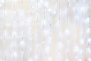 garland illumination for the holidays and Christmas with glowing light bulbs made from lines along...