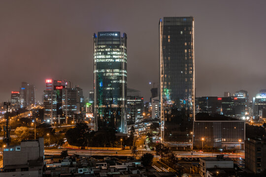 View of skyline in San Isidro district at night. 