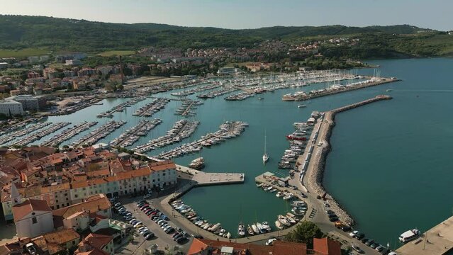 Long aerial drone flight to marina Izola with boats, Slovenia.