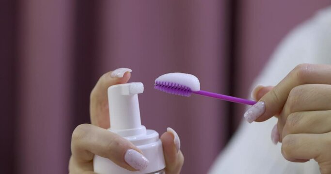 the process of cleaning the brush with foam shampoo. eyelash extension